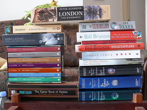 Stack of fiction books on a desk